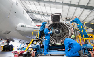 Employees working on aerospace turbine