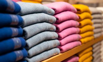 Stacks of linens on a shelf