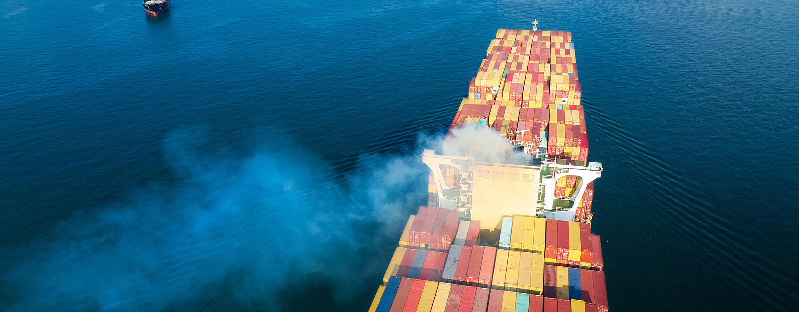 Container emitting fumes, highlighting IMO 2023 regulations importance.