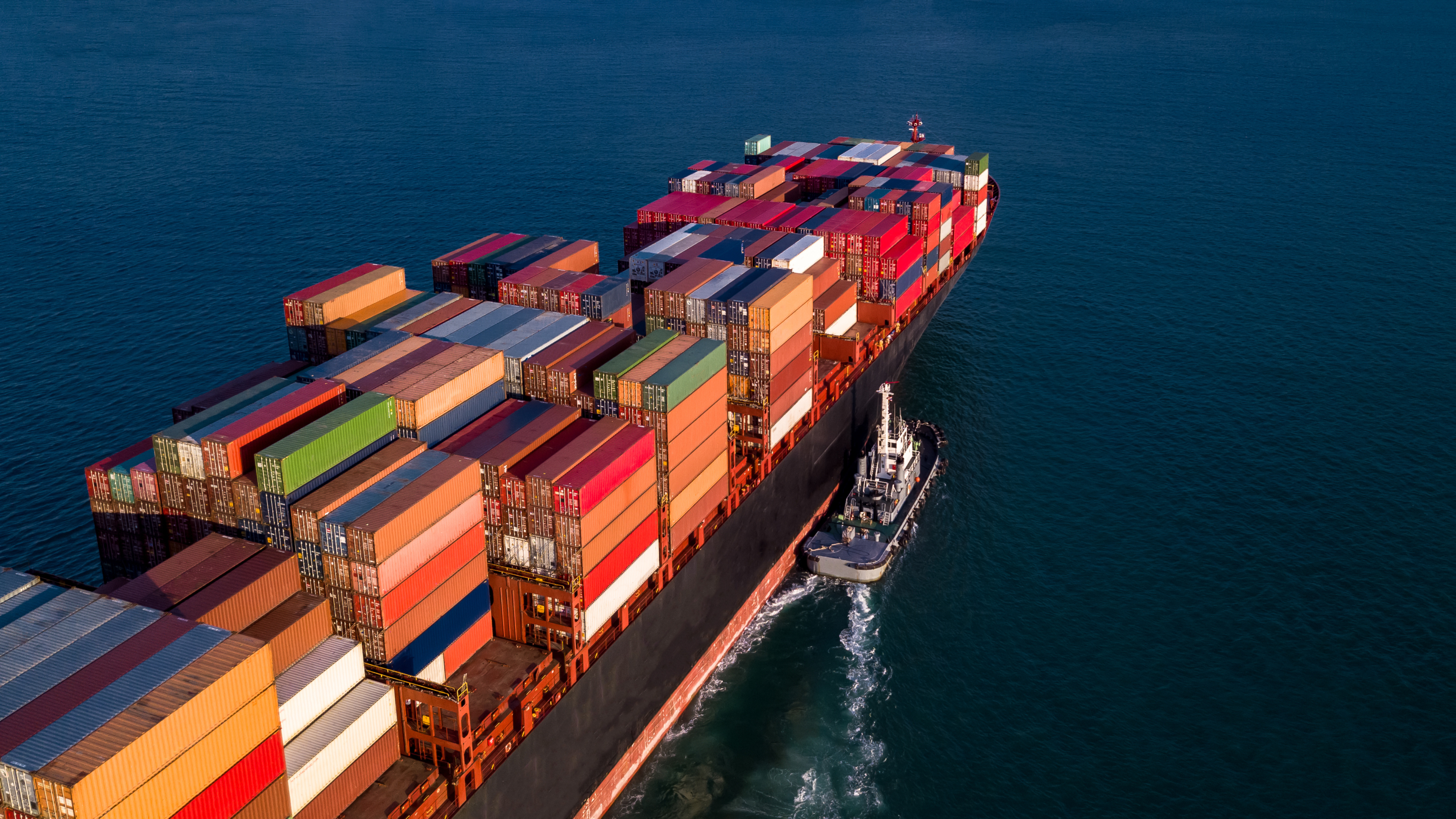 Container used in ocean shipping. Containers of many colors in the middle of the sea.