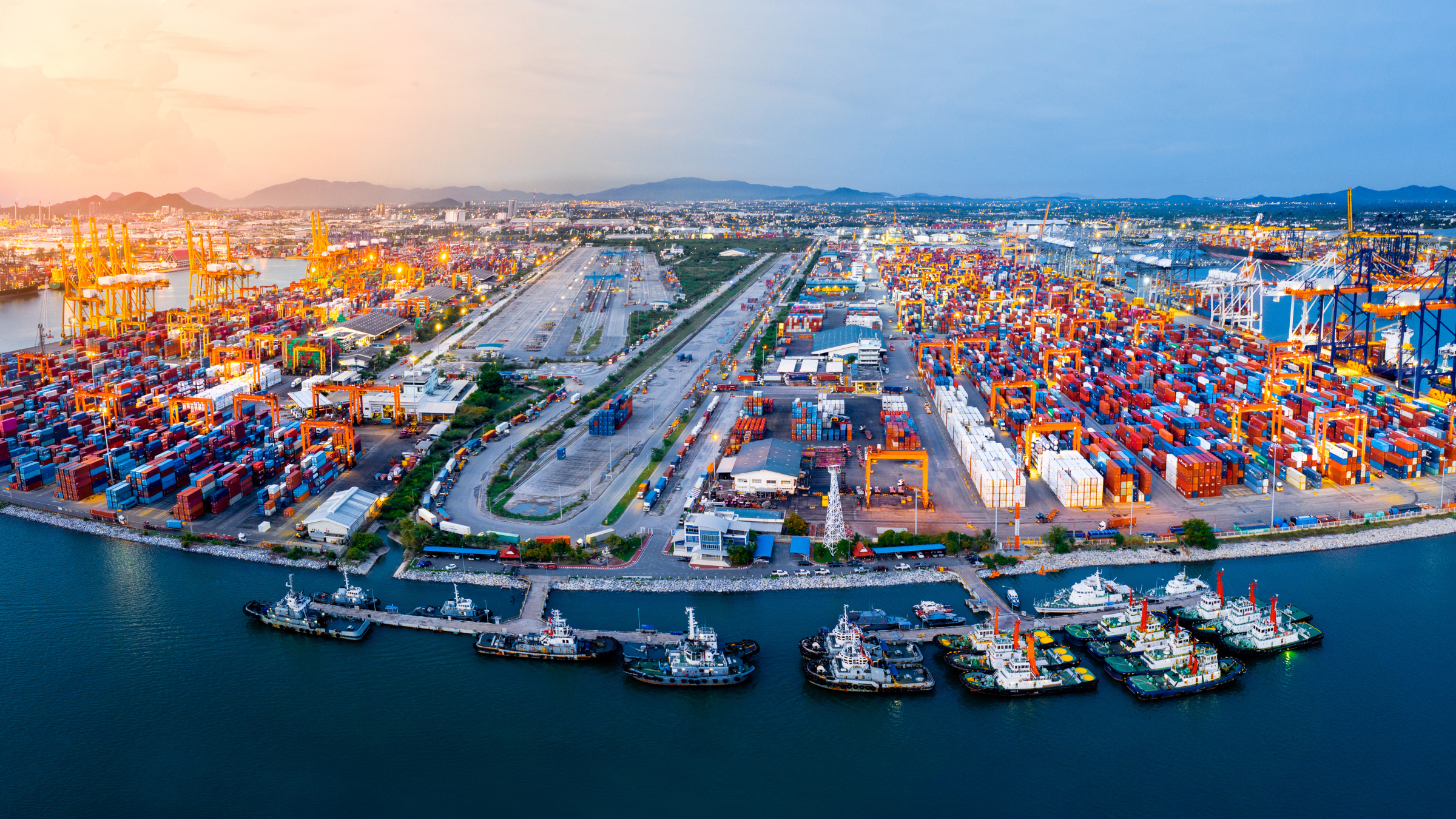 Aerial view over a port, signifying freight forwarding and NVOCC.
