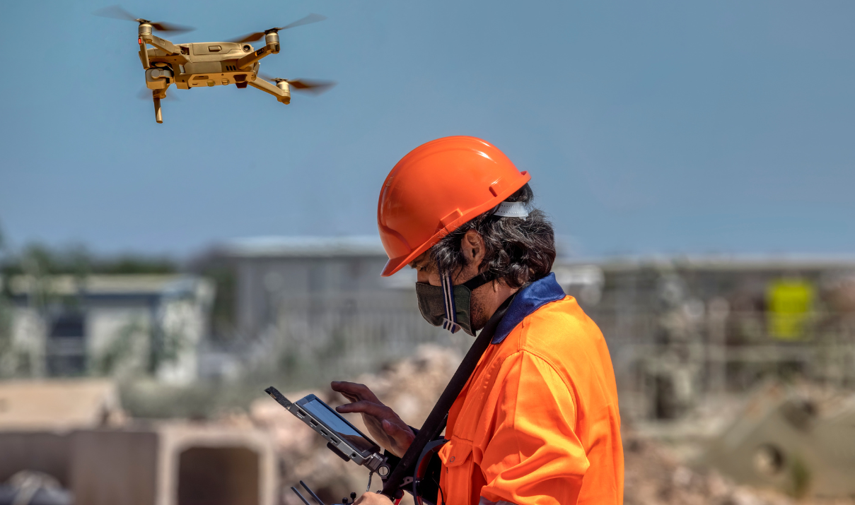 Worker operating a drone using lithium polymer batteries in shipping operation