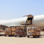 Airline ULDs being loaded onto airplane