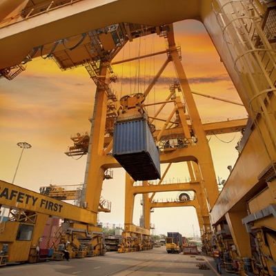 Blue cargo container being lifted — ocean freight