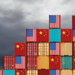 Stacked shipping containers painted with U.S. and China flags, symbolizing trade relations and the current tariff truce.