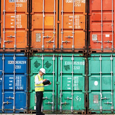 Worker in high visibility jacket conducting a container audit