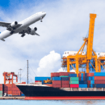 Container ship at port with cargo cranes and airplane in flight, representing current air and ocean freight trends
