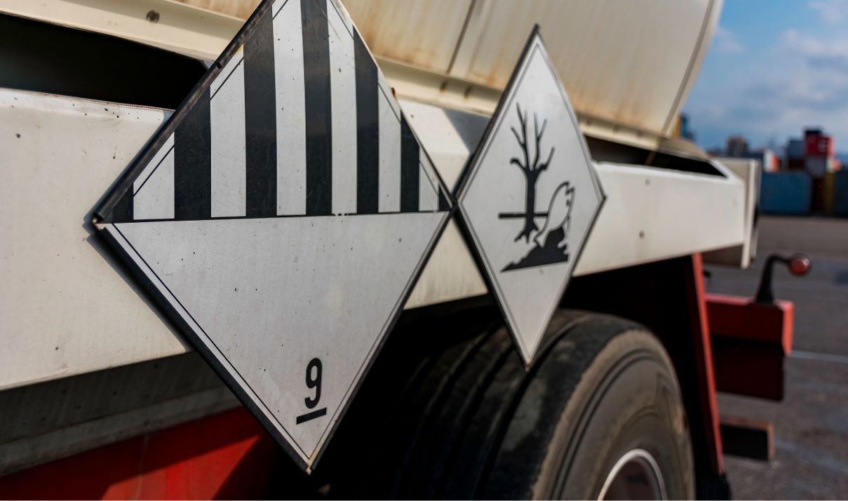 Warning labels for Class 9 hazardous materials on a transport truck used in cold chain logistics