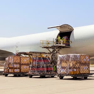Airline ULDs being loaded onto airplane