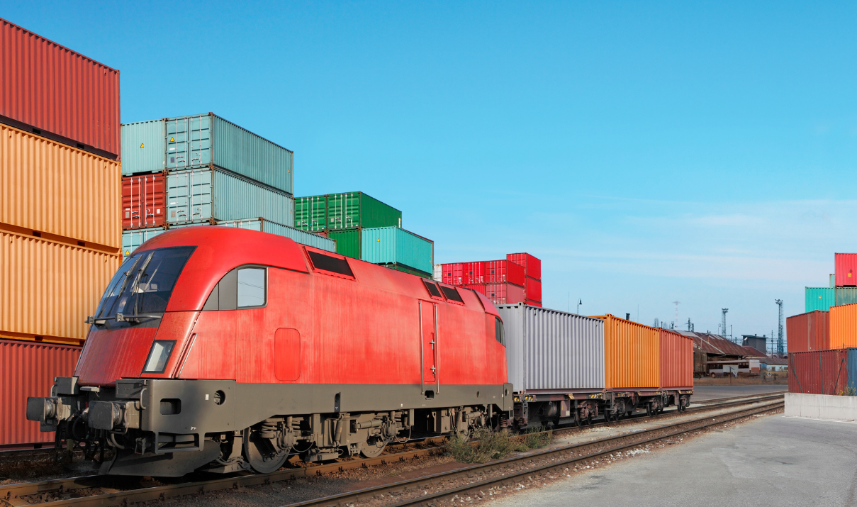 Freight train at intermodal container terminal illustrating multimodal transport logistics and seamless cargo transition