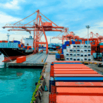 Container port with cargo ships and stacked freight boxes, representing Asia-based freight strategy in 2026