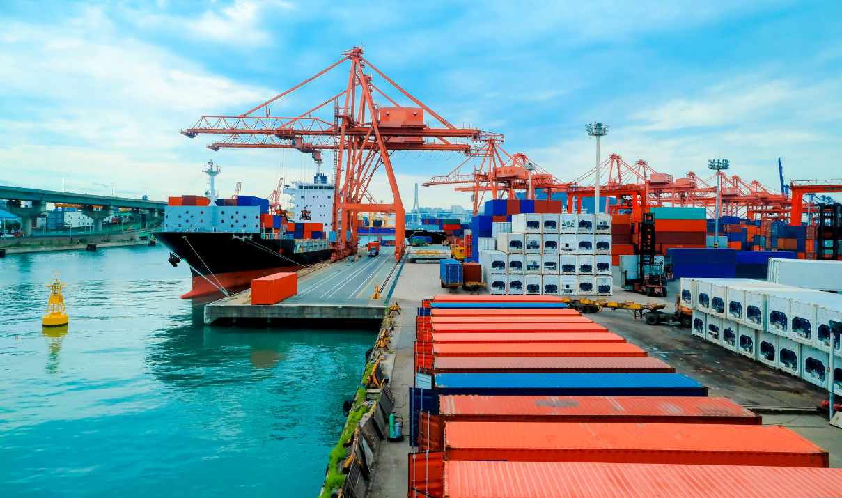 Container port with cargo ships and stacked freight boxes, representing Asia-based freight strategy in 2026