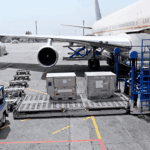 ULD containers being prepared for loading at an airport, illustrating air freight container dimensions