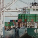 Container ship at port reflecting tariff uncertainty in global supply chain operations