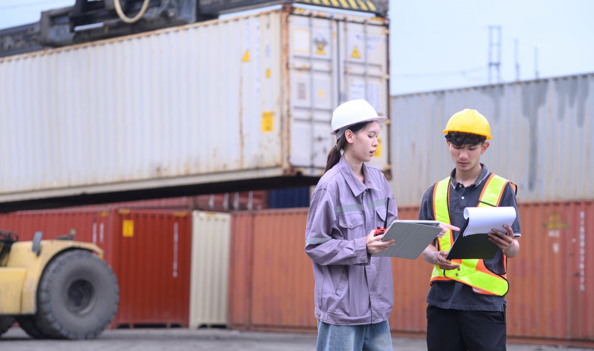 Trade compliance professionals reviewing shipment documentation for IEEPA refund recovery preparation