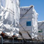 Lithium battery shipments packaged and labeled for air freight compliance with IATA dangerous goods regulations in electronics shipping