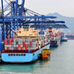 Container ships docked at a major port terminal, illustrating global container trade and international cargo movement.