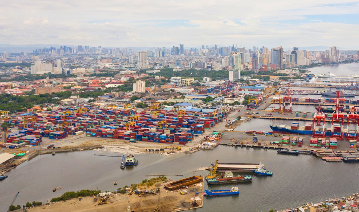 Shipping from the Philippines through the Port of Manila with container terminals, cargo vessels, and the Manila skyline