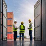 Workers inspecting shipping containers during an IEEPA Tariff Refund Update for U.S. importers and customs compliance.