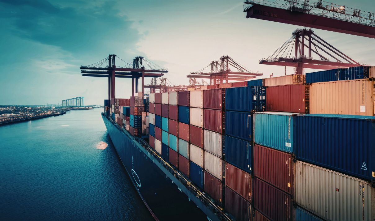 Cargo ship carrying containers at a global port, representing tariff engineering and international import logistics.